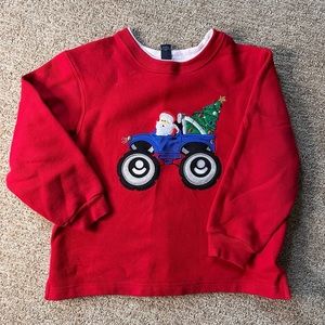Embroidered Christmas Santa in Monster truck sweater.